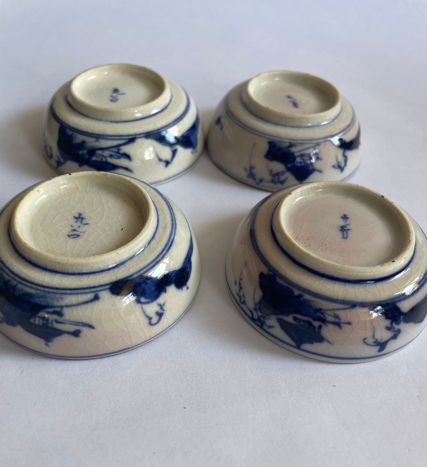 Soy Sauce Dishes with Blue Sometsuke Drawings on outside Baase - Clay Enameled in Morriage Cherry Blossoms - sold as set of 4 - Vintage 1910, inverted_view