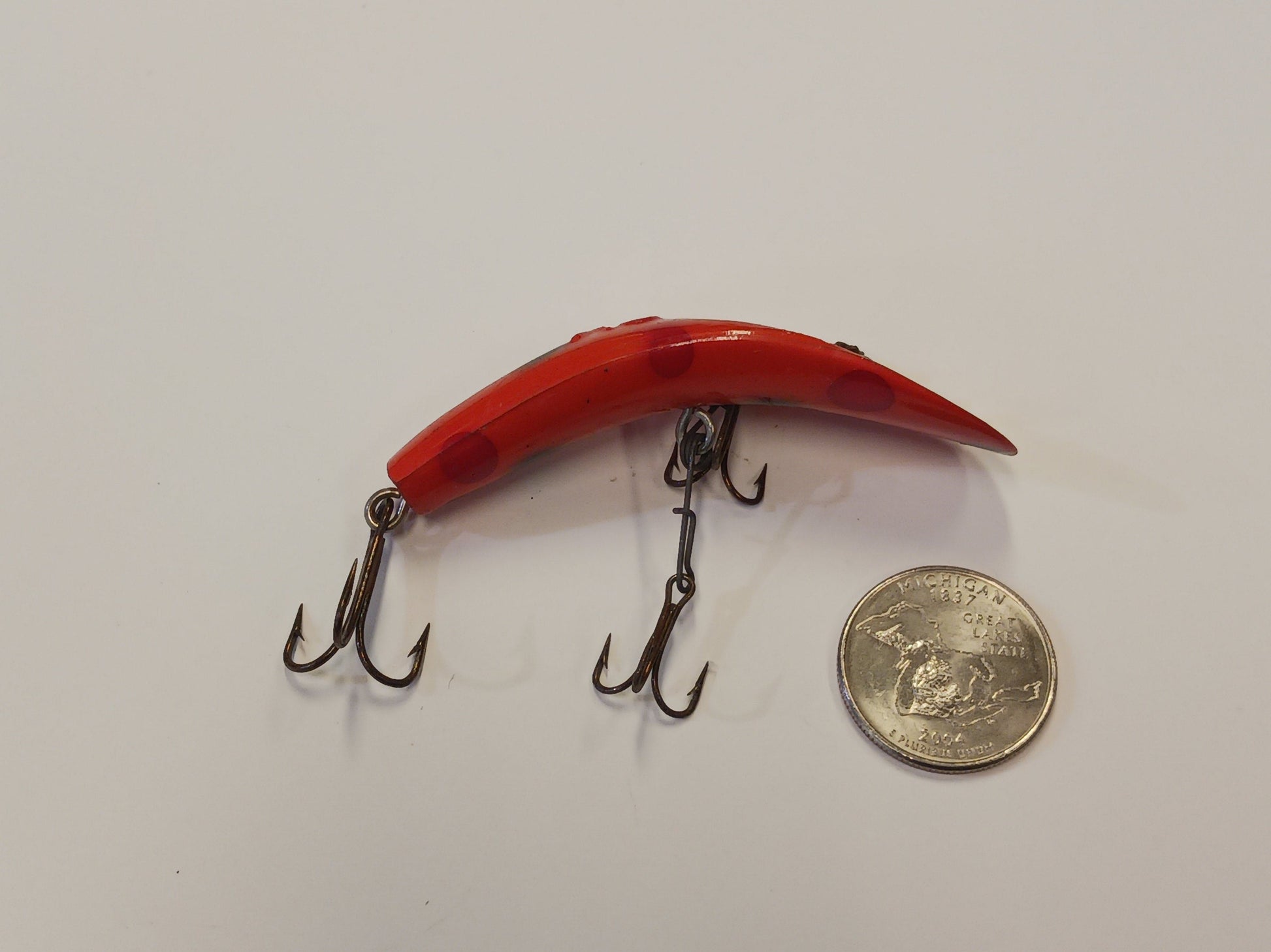 Flatfish Fishing Lure, with quarter for size