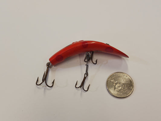 Flatfish Fishing Lure, with quarter for size