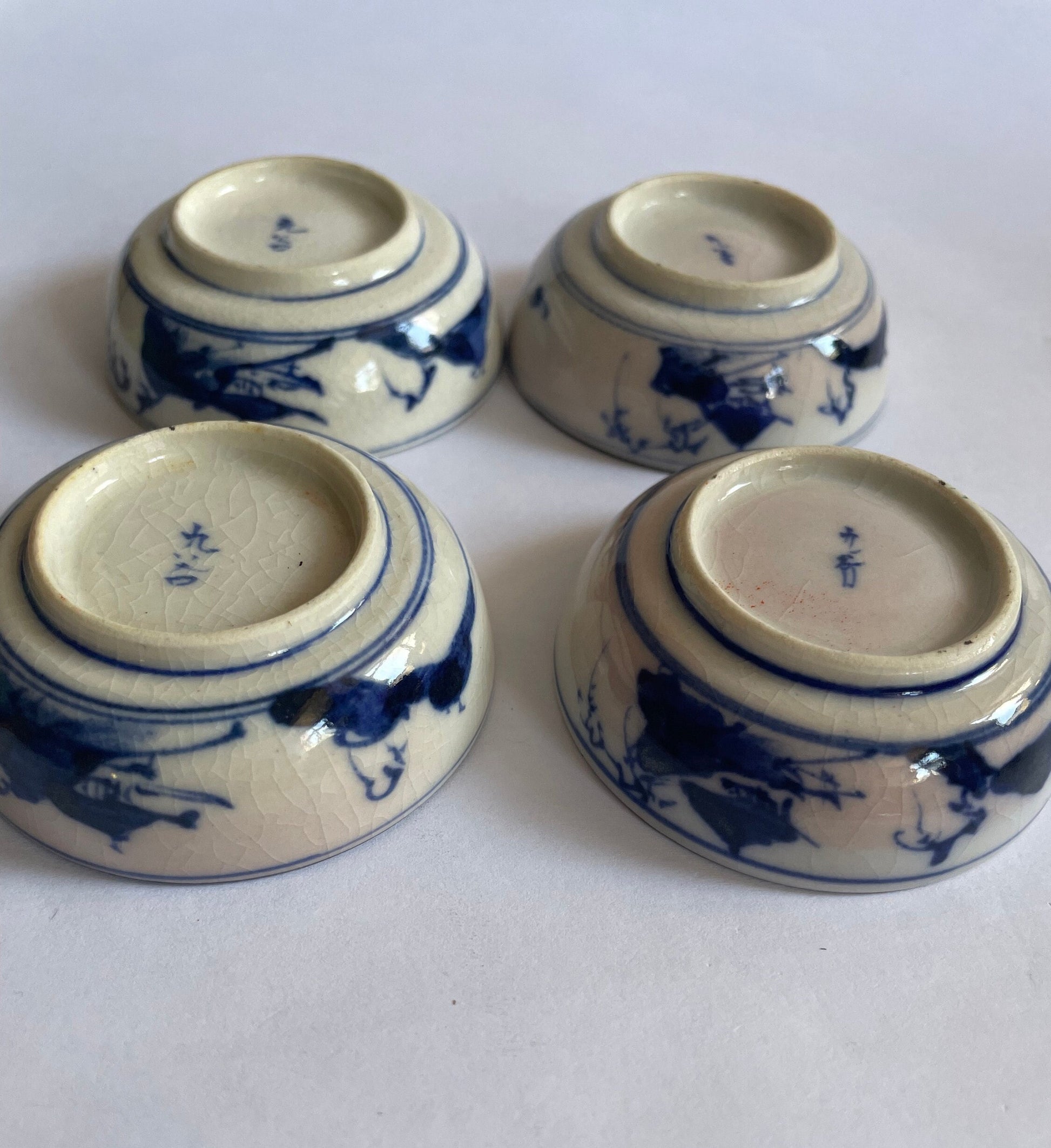 Soy Sauce Dishes with Blue Sometsuke Drawings on outside Baase - Clay Enameled in Morriage Cherry Blossoms  - sold as set of 4 - Vintage 1910, inverted_view
